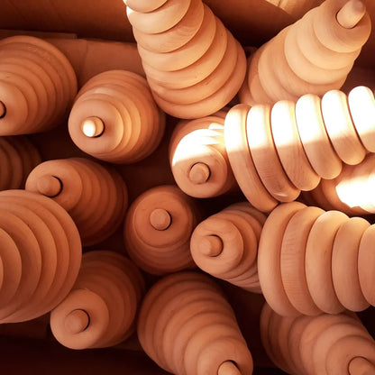 Many Wooden Montessori ring stacking pyramids in the box