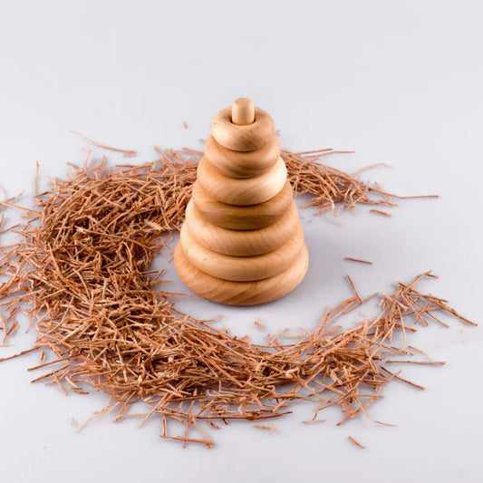 Wooden Montessori ring stacking pyramid toy for toddlers with natural wooden rings on a vertical peg, designed for fine motor skills, hand-eye coordination, and educational play.