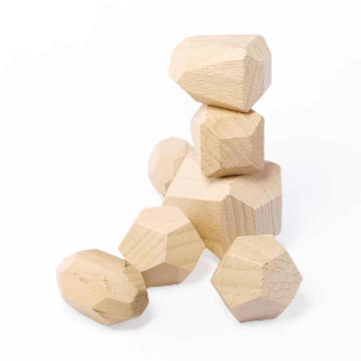 A pile of wooden stacking stone toys