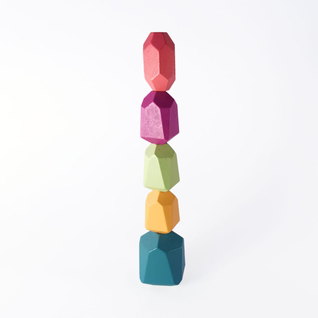 Colorful Montessori wooden stacking stones for babies and toddlers.